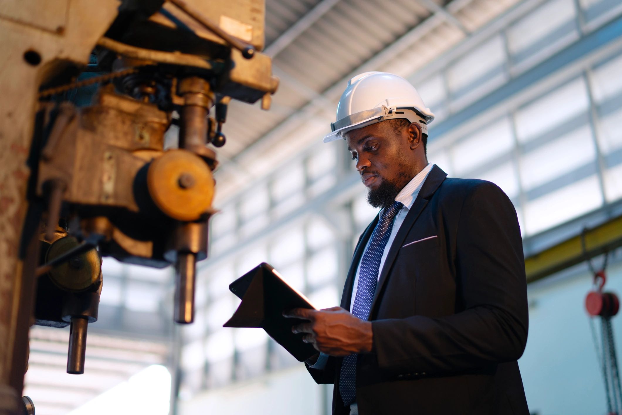 Engineer reviewing plans and documentation for a mechanical project