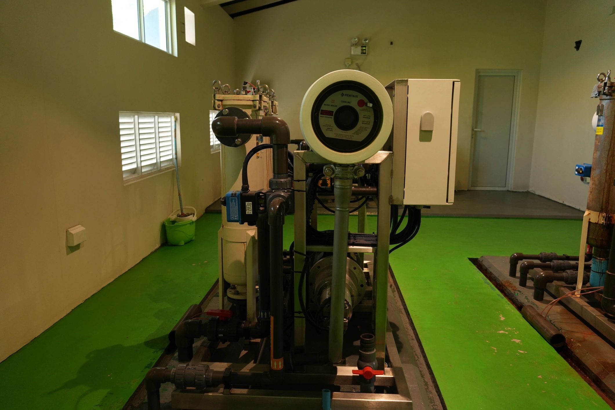 Mechanical room with industrial equipment and piping